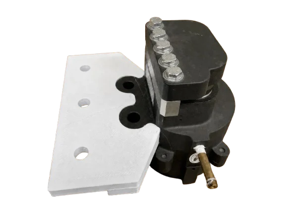 White brake mount positioned against a black pneumatic brake caliper